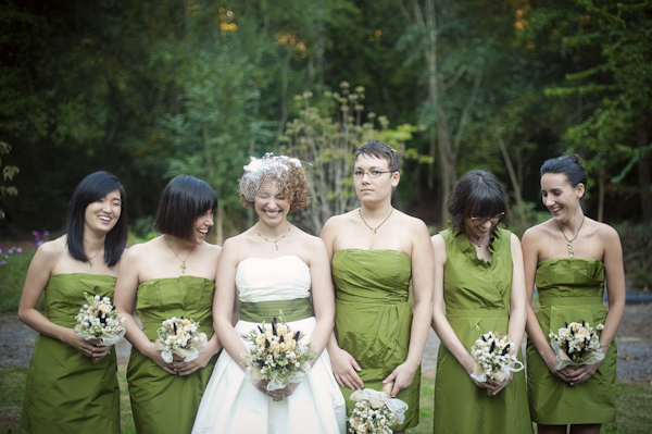 bride and bridesmaids in chartreuse laugh while posing for photos - wedding photo by top Atlanta based wedding photographers Scobey Photography